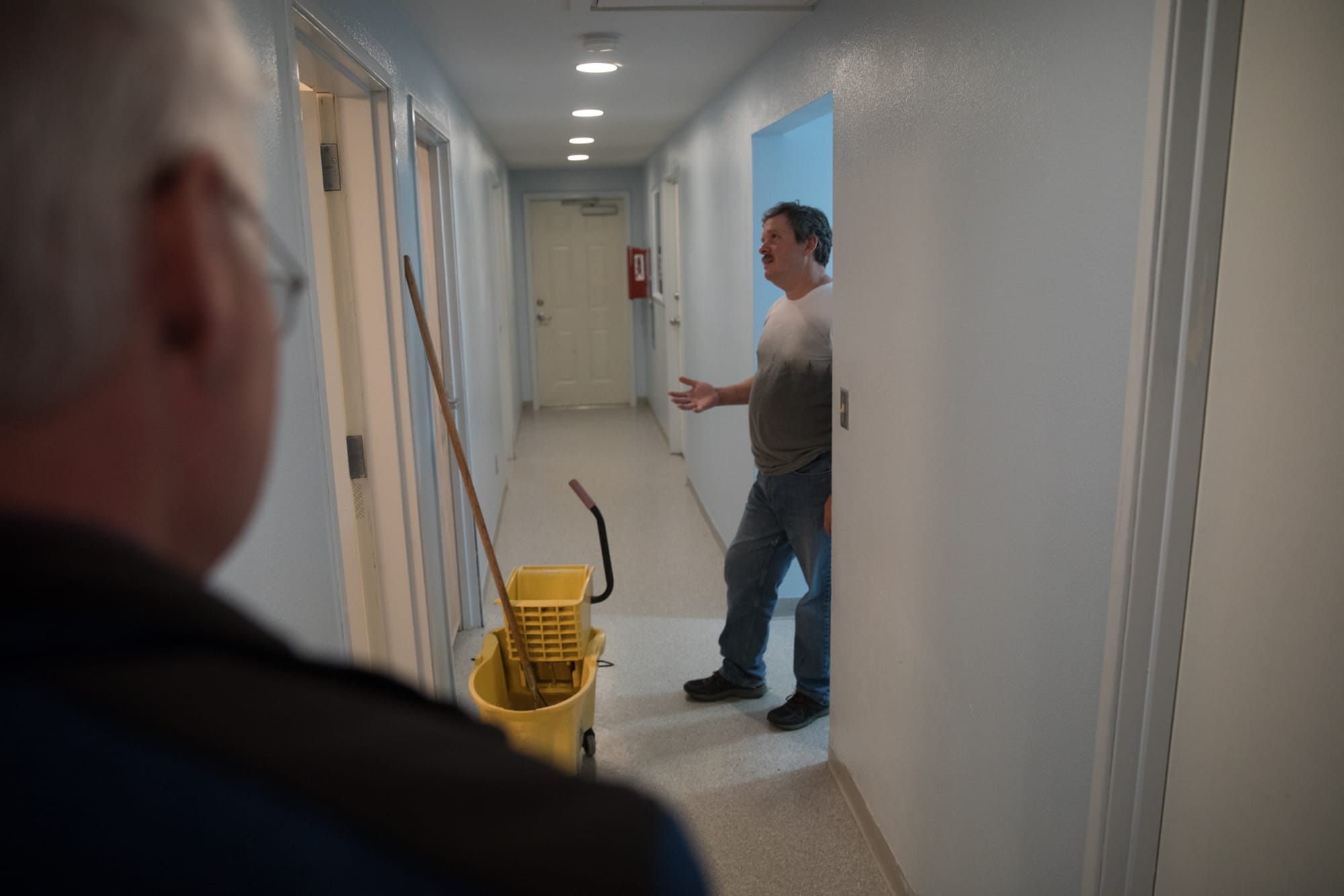 Secret Harbor House Manager Frank Hasenbalg inside the hall of one of the organization's homes in Burlington, Washington. (Matt M. McKnight/Crosscut)