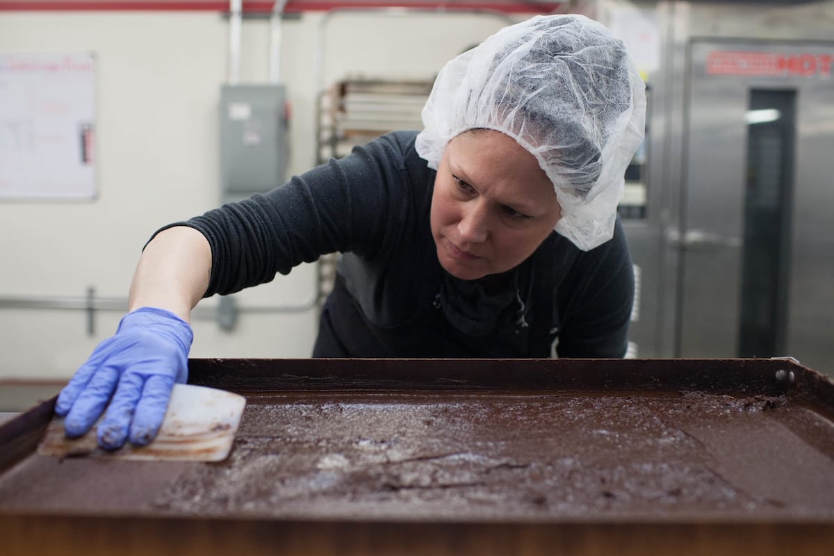 A worker prepares marijuana infused brownies.