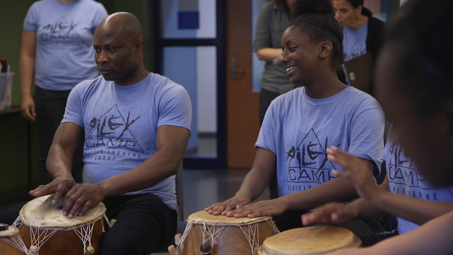 People learning in a percussion class