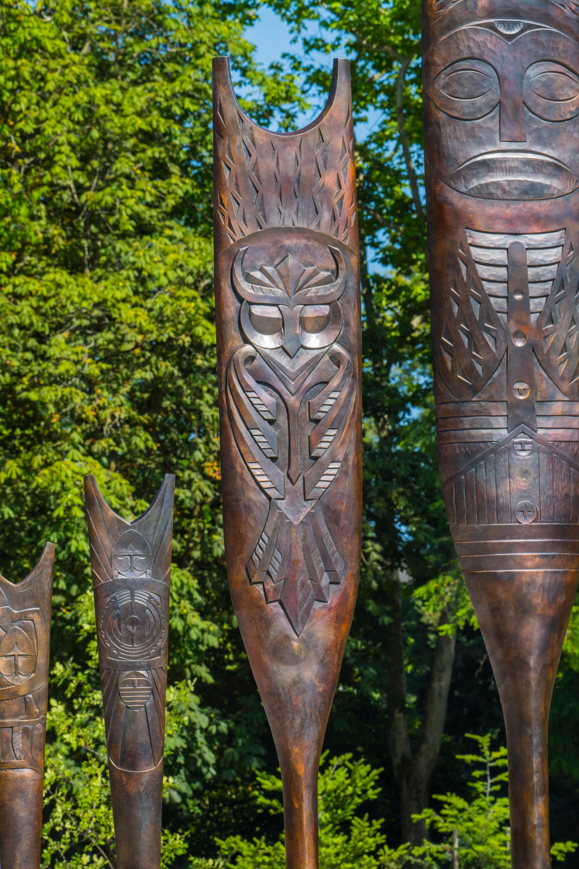 Bronze paddles with intricate designs