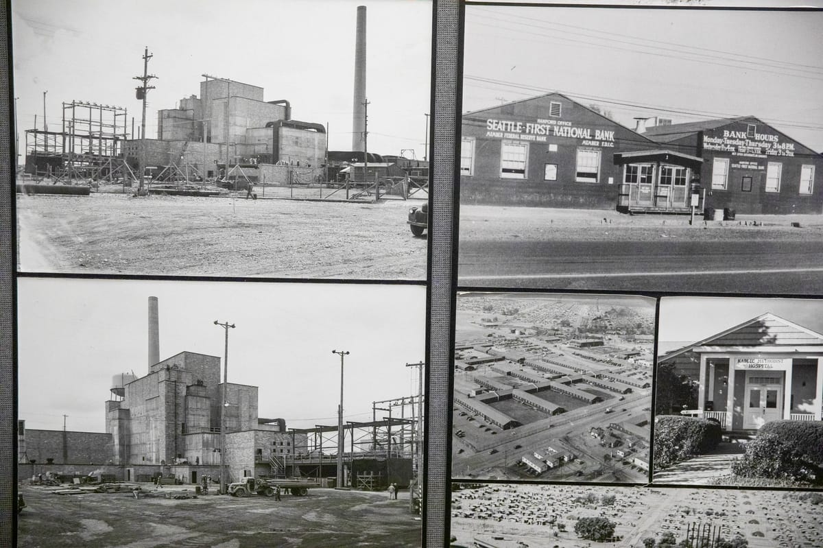 Black and white photos of the B Reactor, a rather unassuming rectangular building, at the Hanford site on Wednesday, Oct. 12, 2022.
