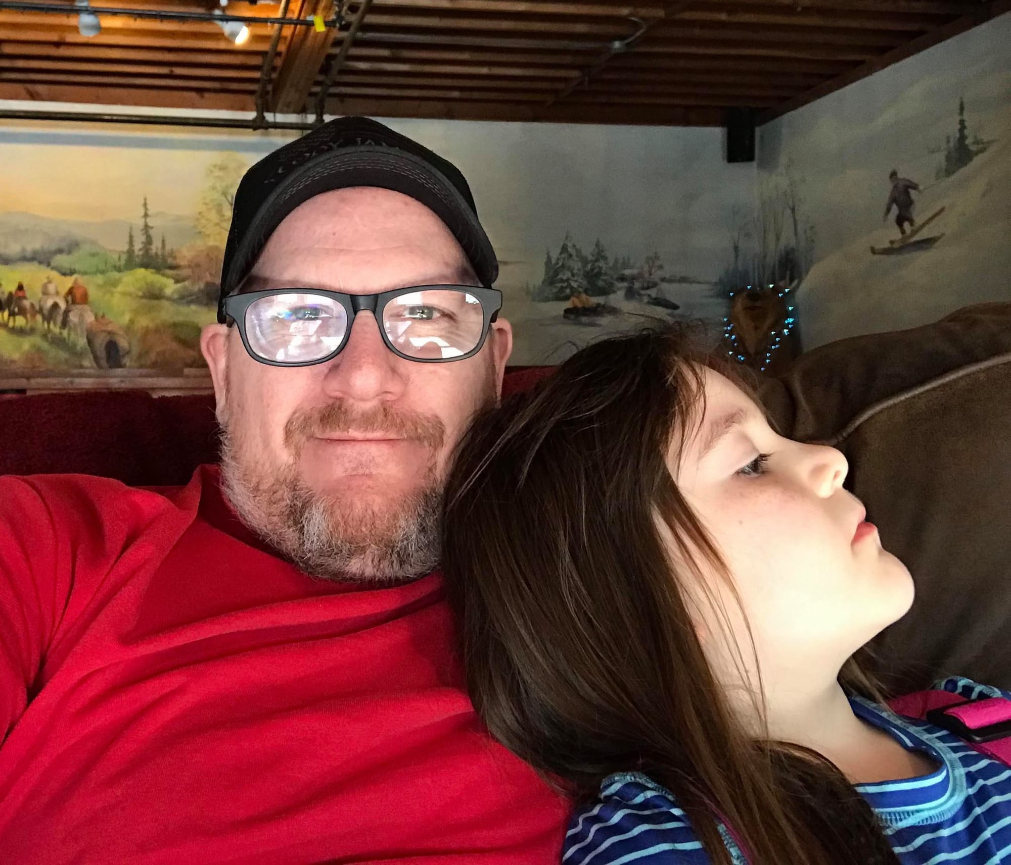 Cody James sits with his daughter