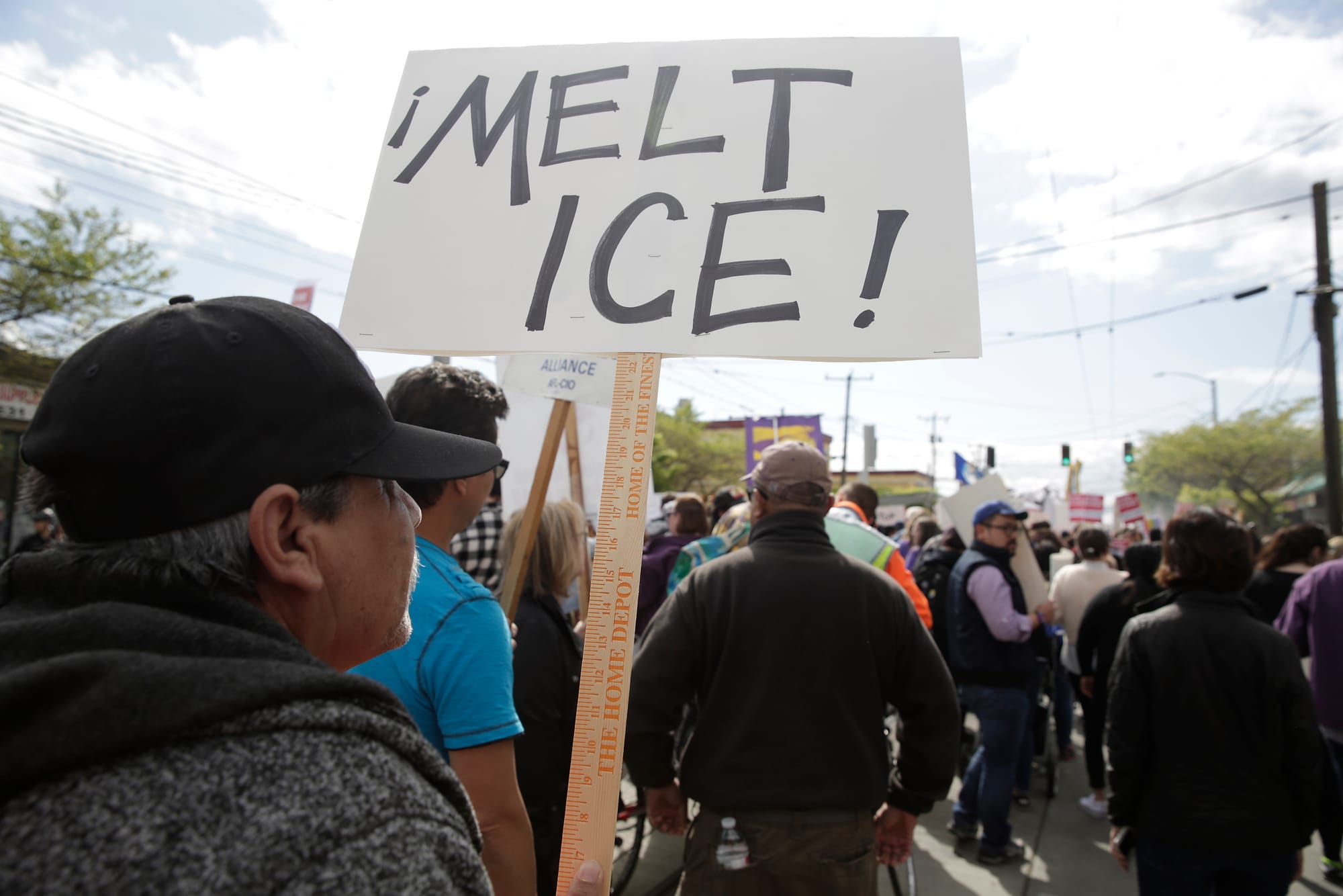 Clemente Rodriguez of Seattle carries sign referring to the Immigration and Customs Enforcement (ICE) sign during the annual May Day March for Workers and Immigrant Rights in Seattle