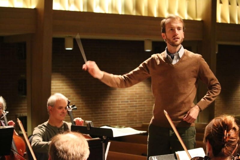 A man conducting an orchestra