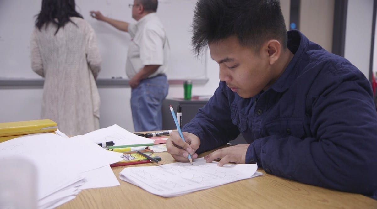 Joshua Villanueva arrives hours earlier than most of his peers for math tutoring. He is looking forward to graduation from Seattle World School next year.