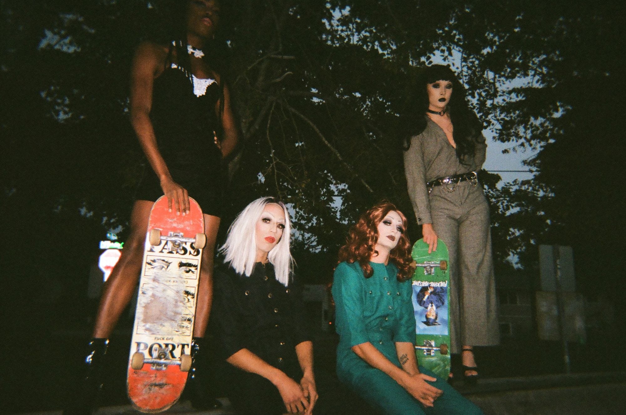 Four skaters in drag.