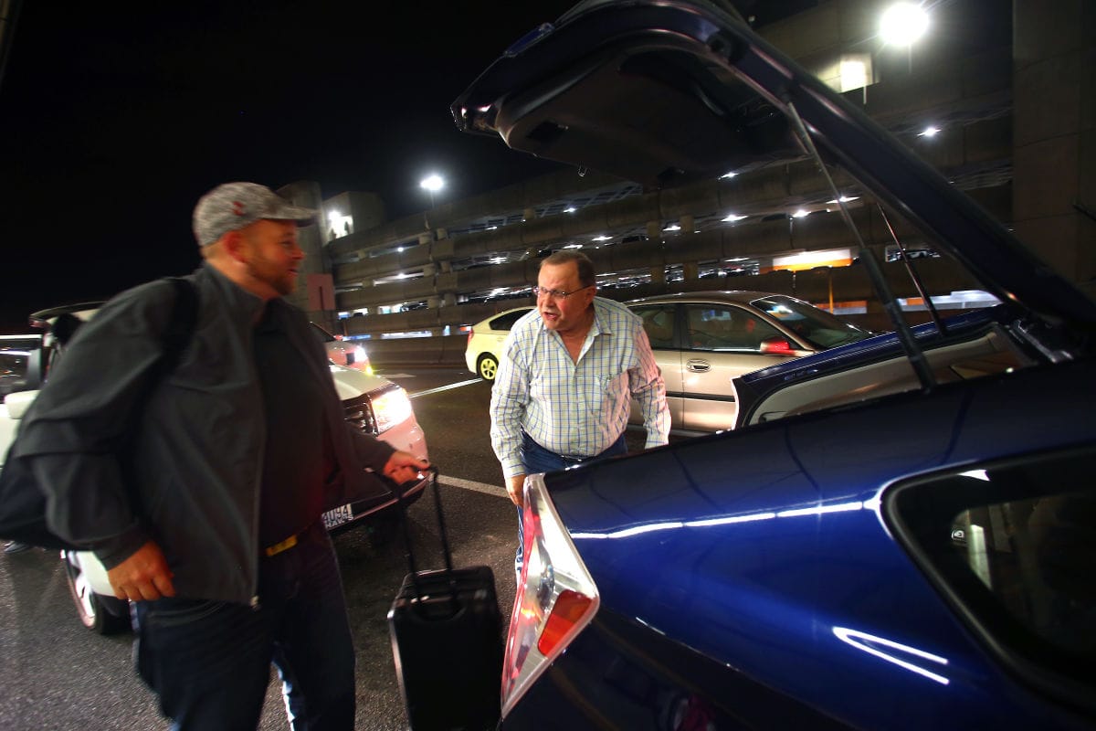 Mayor David Baker drops off an Uber passenger, John Stokamp, at SeaTac Airport.