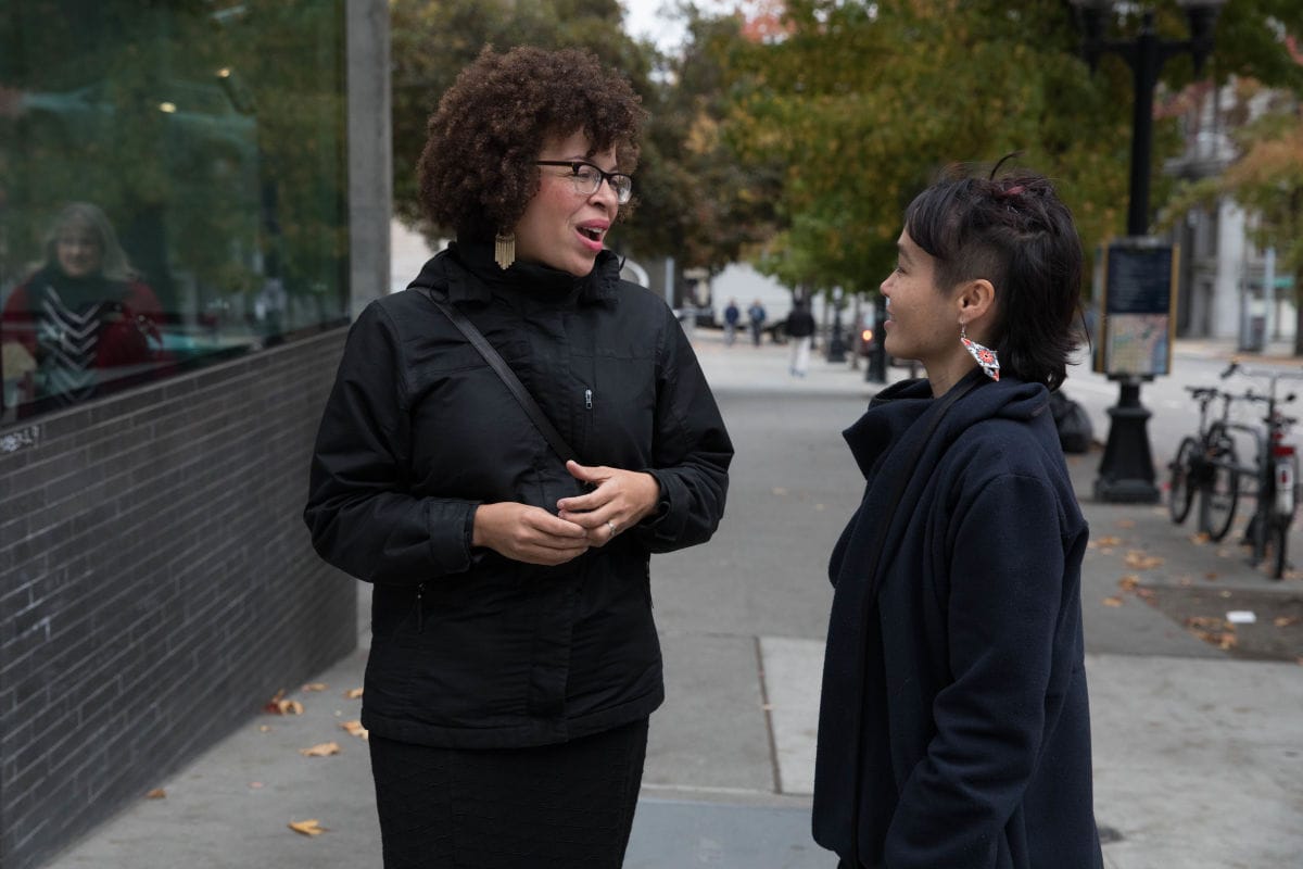 Harris-Talley speaks with legislative assistant Joselynn Tokashiki Engstrom outside of City Hall on a lunch break.