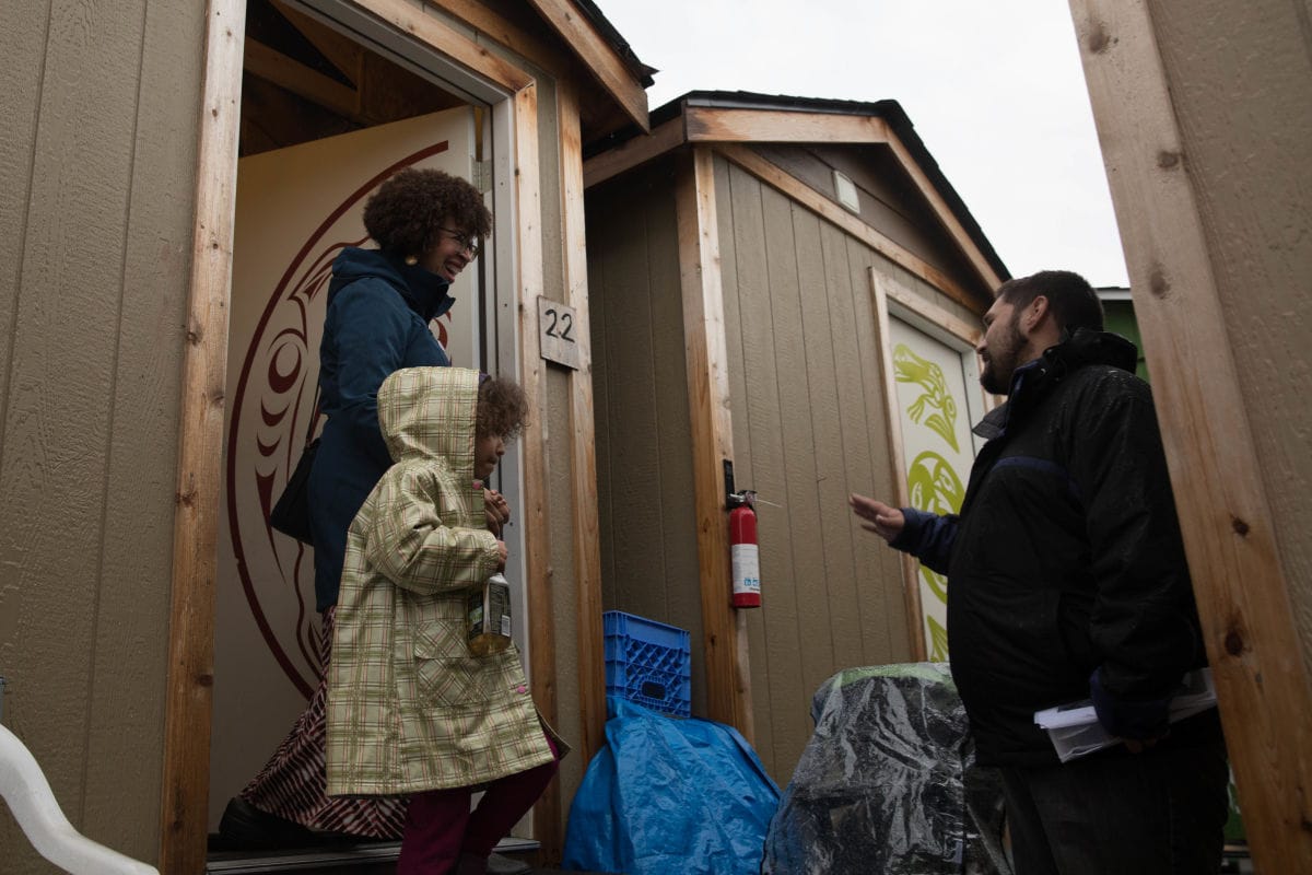 Harris-Talley and her daughter tour Nickelsville Othello, a city-sanctioned  encampment in Rainier Valley.