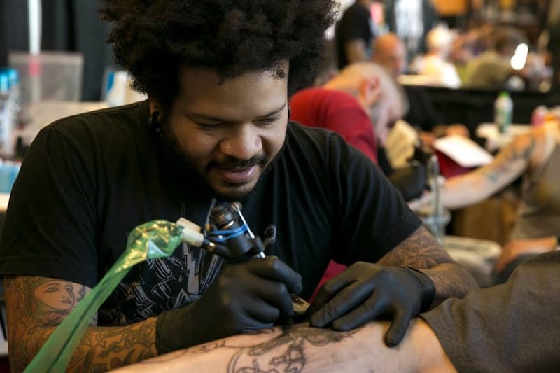 A tattoo artist at work