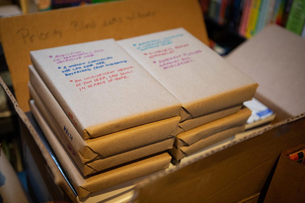 Books are wrapped in brown paper