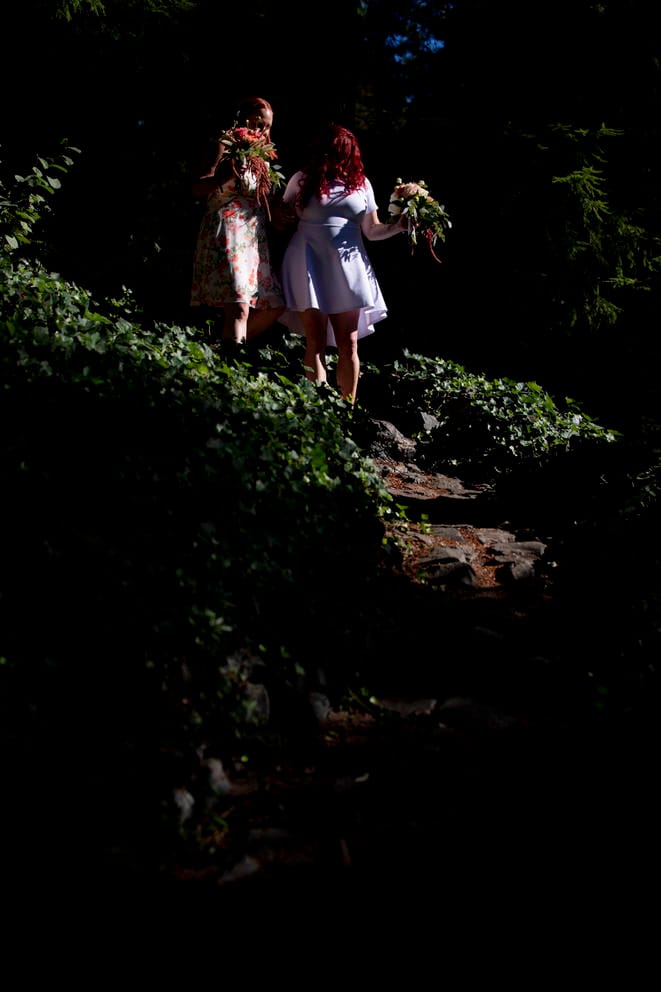 Jessica and Maia walk down their cobblestone path