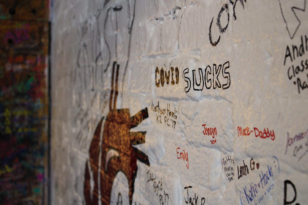 Graffiti on the walls of The Coug bar, including one that says 