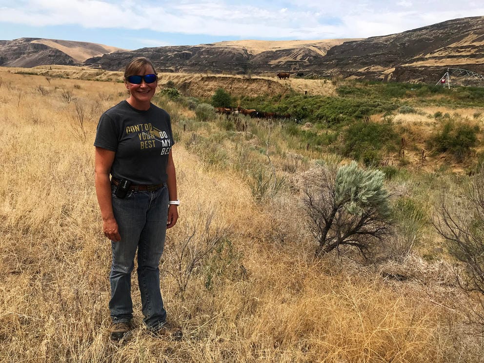 Woman standing in countryside