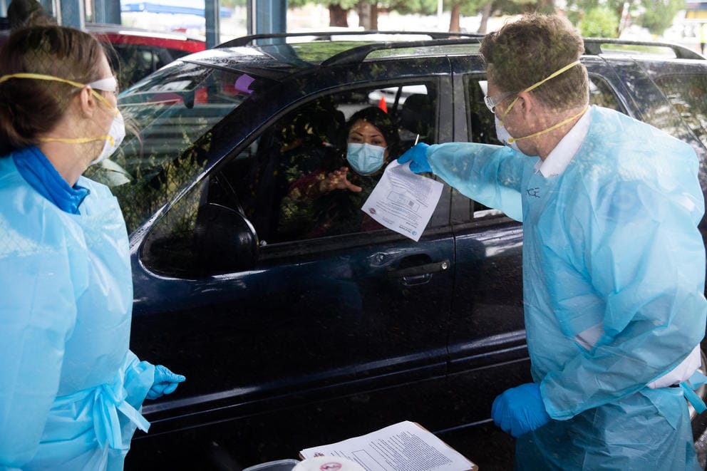 driver in car getting a COVID-19 test