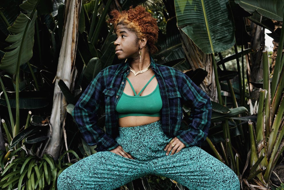 Sassyblack poses with her hands on her hips