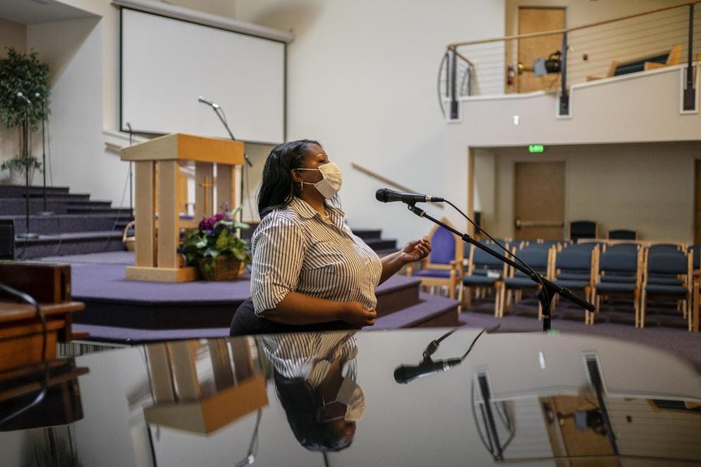 Person in church in front of microphone
