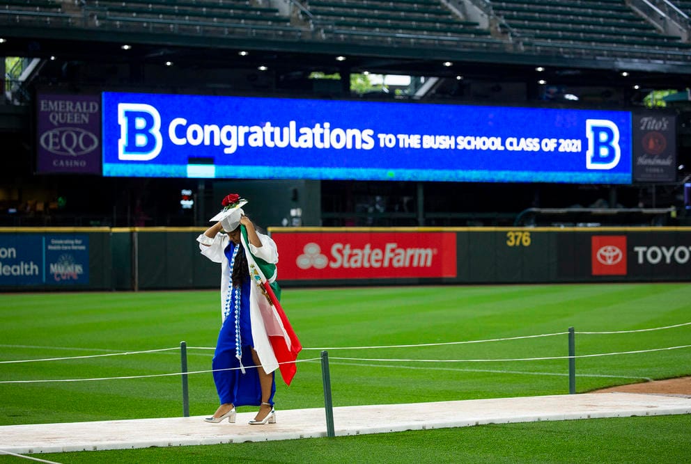 A young woman in a graduation cap and gown