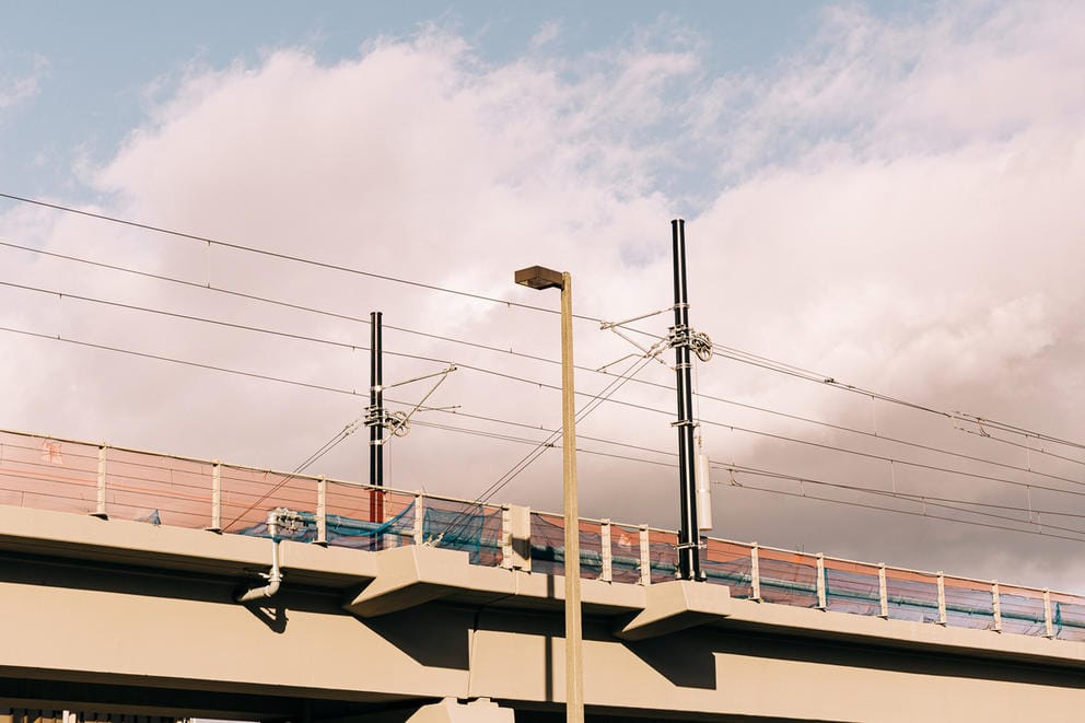 A concrete train track with the sky above