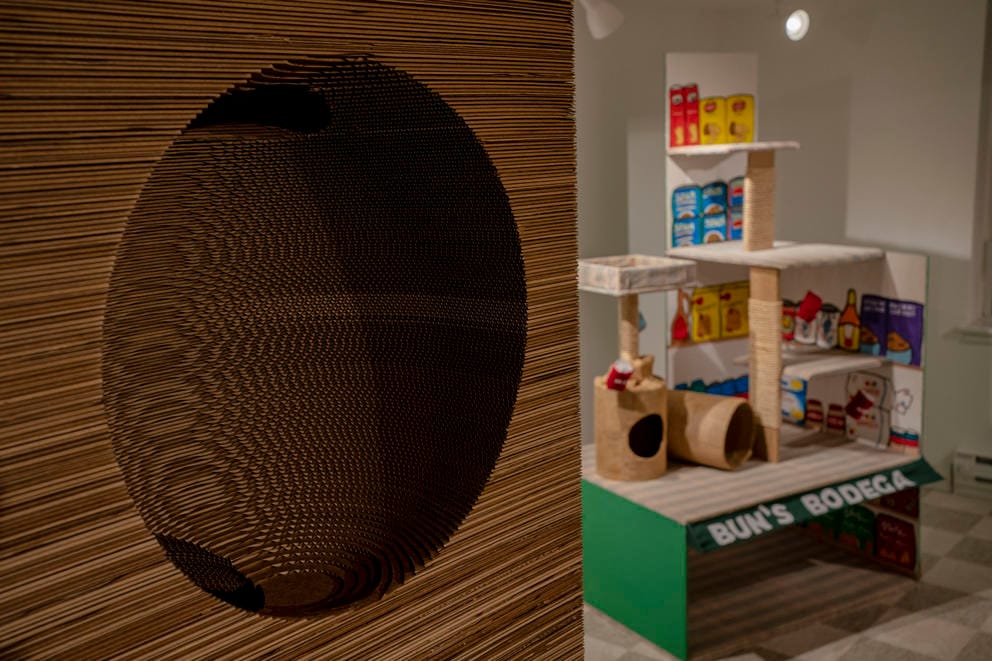 A brown sculpture with a convex cut out in the center
