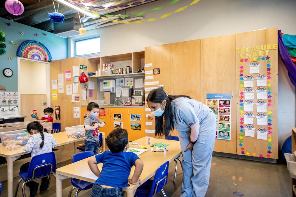 Teacher iinteracts with preschool students in Yakima.