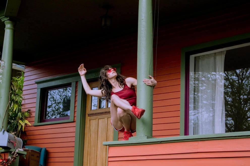 woman dancing on a porch