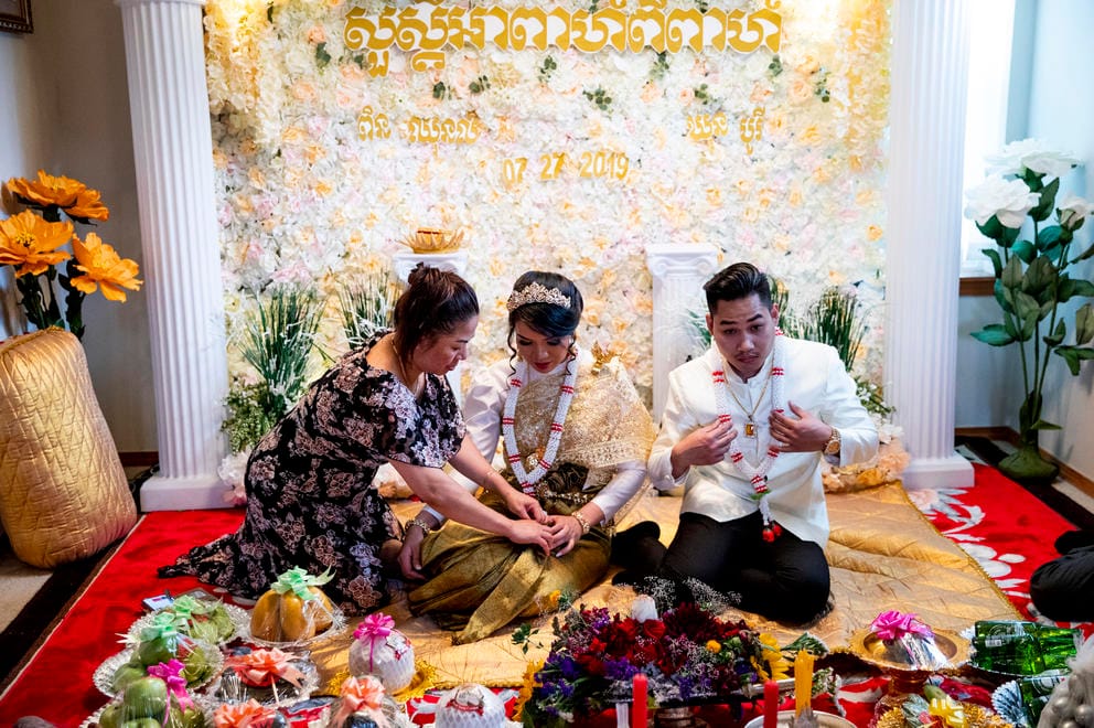 Nary fixes the bride's skirt