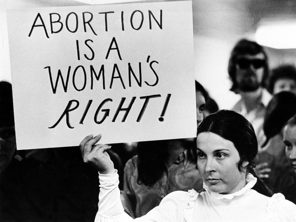 Abortion protest in the 1970s. One sign reads 