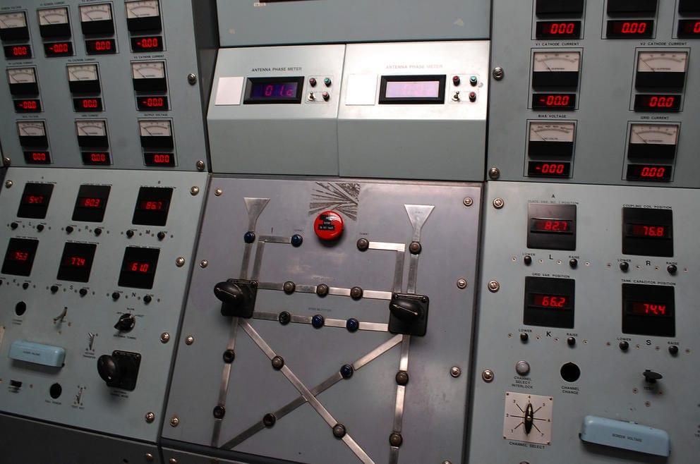 A control panel with many rows of buttons