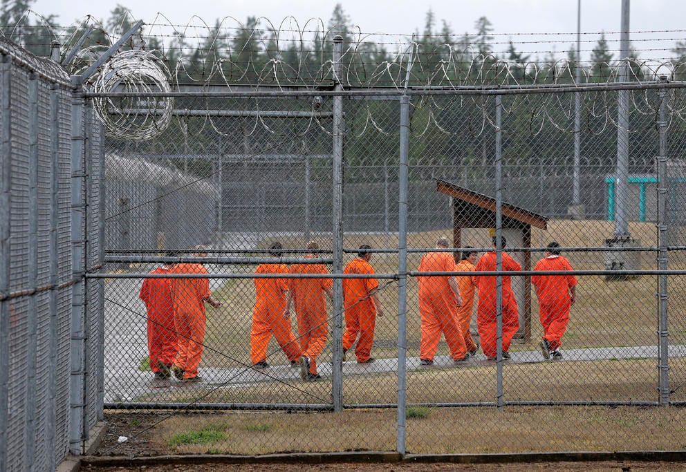 prisoners walking toward an exercise yard in Shelton