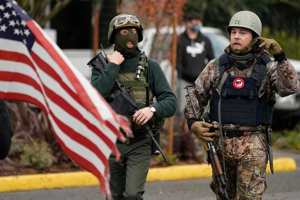 Flag and two people with guns and helmets