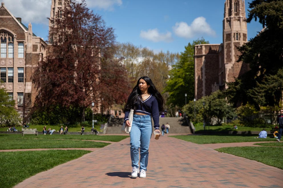 Kimberly Quiocho walks through the UW quad