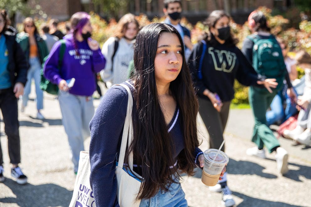 Kimberly Quiocho walks through a crowd