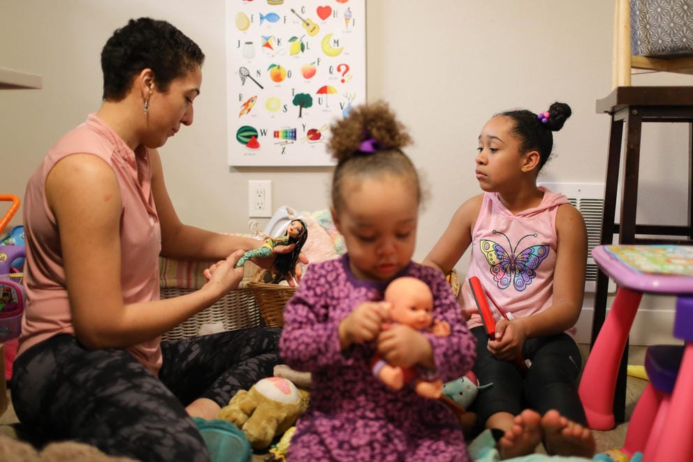 Sequoia Dolan and her daughters, Jaeleah, 10, and Zayah, 2, play with dolls at home.