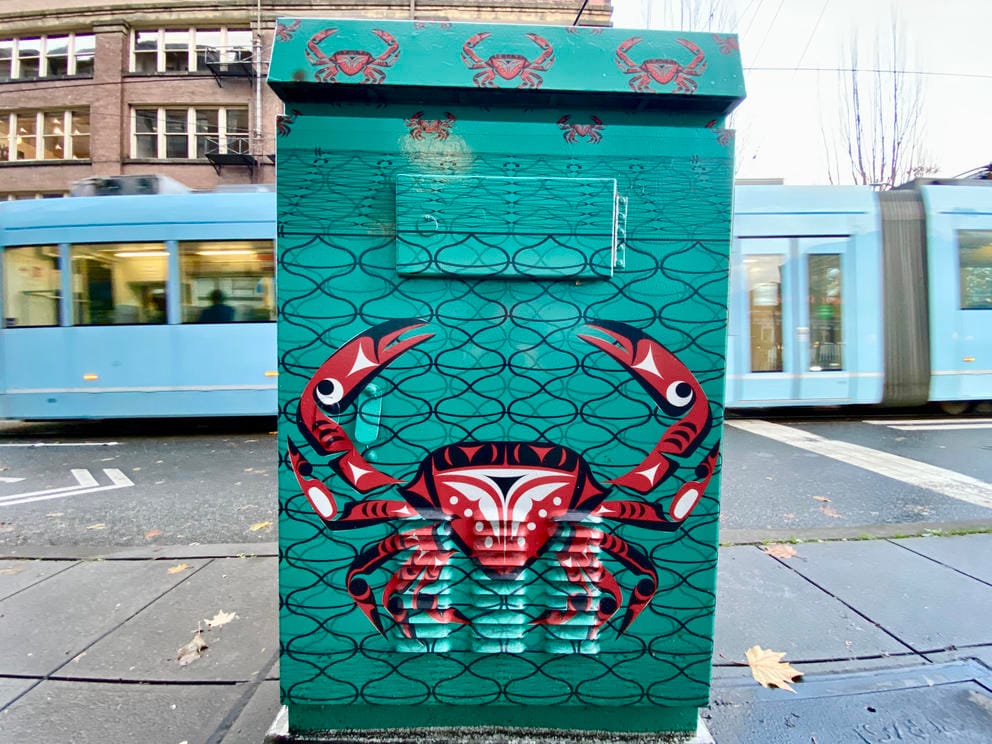 red formline crab on green background on electrical box