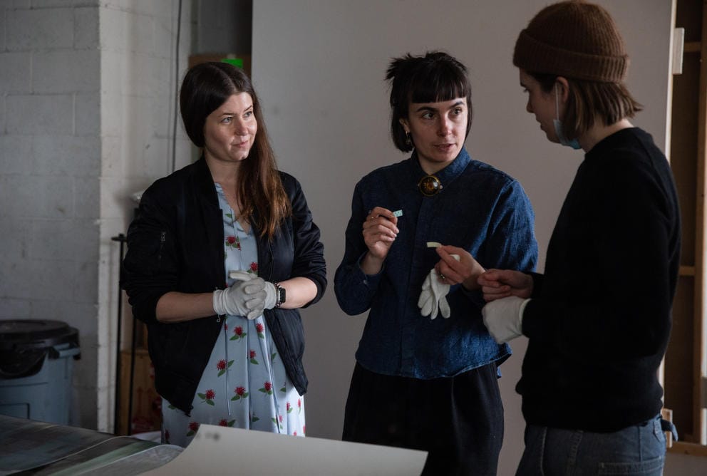 Three people discussing
