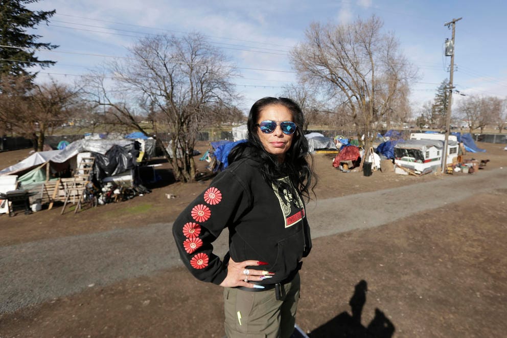 Julie Garcia, executive director of Jewels Helping Hands, stands at Camp Hope