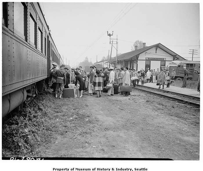 Japanese Americans boarding train for Minidoka