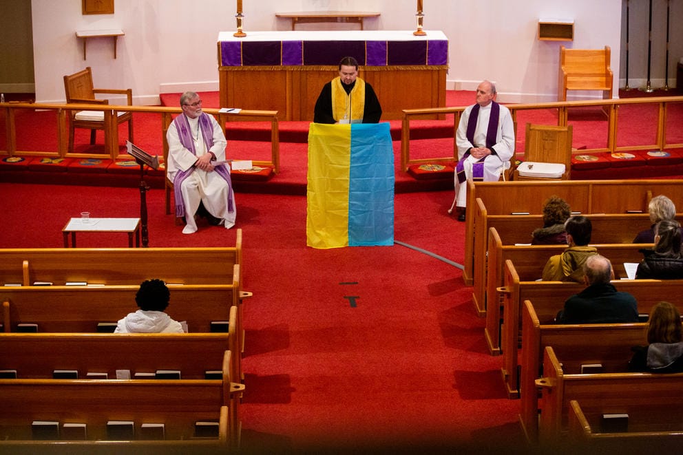 Father Andriy Matlak delivers a prayer.