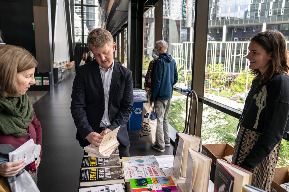 Ken Jennings signs one of his books for Festival attendees