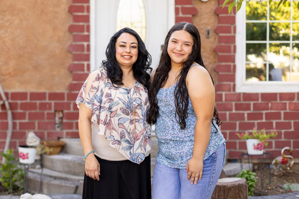 Silvia Zarate and her daughter Daniela outside their home