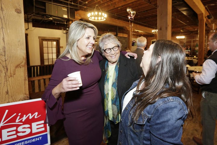 Spokane Mayor Nadine Woodward speaks with Earl Moore and Robin Waller
