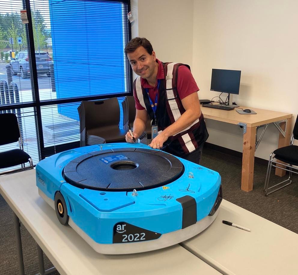 Bruno Arnal smiles in an Amazon vest 