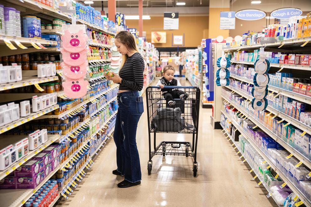 Paige Zorn shops for Zaylin’s baby food at the grocery store in Pierce County