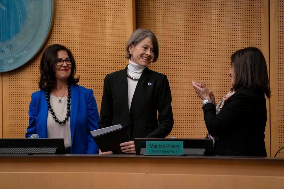 Councilmember Sara Nelson, center, receives recognition being chosen as council president