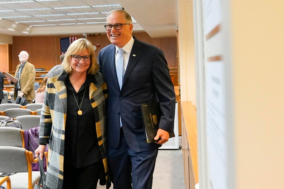 Washington Gov. Jay Inslee leaves with wife Trudi Inslee