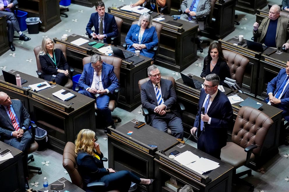 lawmakers on the floor of the House