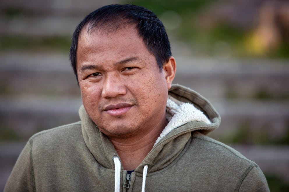 United 6 worker Mickel Mendez poses for a photo