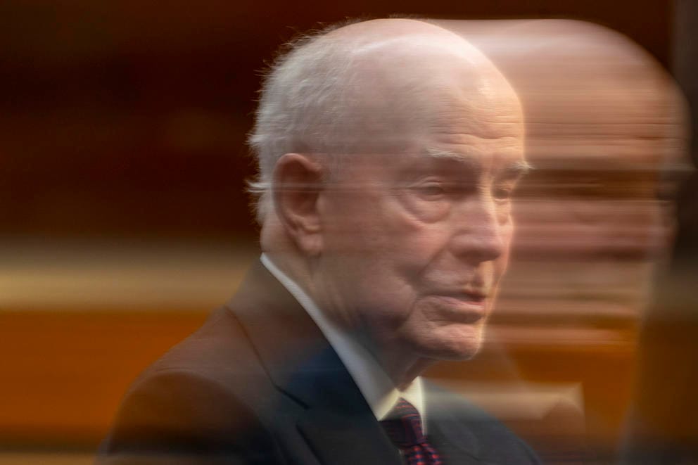 A photo of a person's head in motion blur.