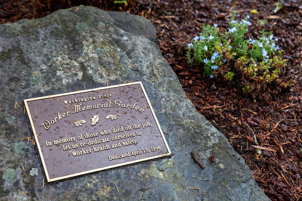 A rock with a memorial plaque.